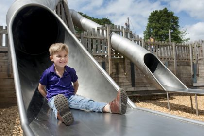 Child on Cannon Hall playground slide