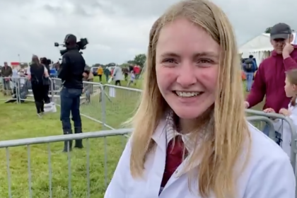 Photo of a show ground and a girl in a white coat