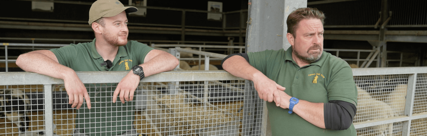 Photo of farmer Richard Nicholson in front of a sheep pen.