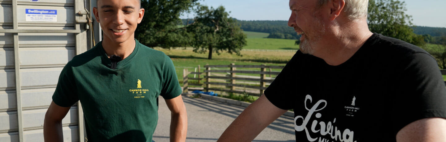 Photo of Robert Nicholson talking to a team member at Cannon Hall Farm