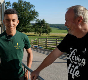 Photo of Robert Nicholson talking to a team member at Cannon Hall Farm
