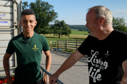 Photo of Robert Nicholson talking to a team member at Cannon Hall Farm