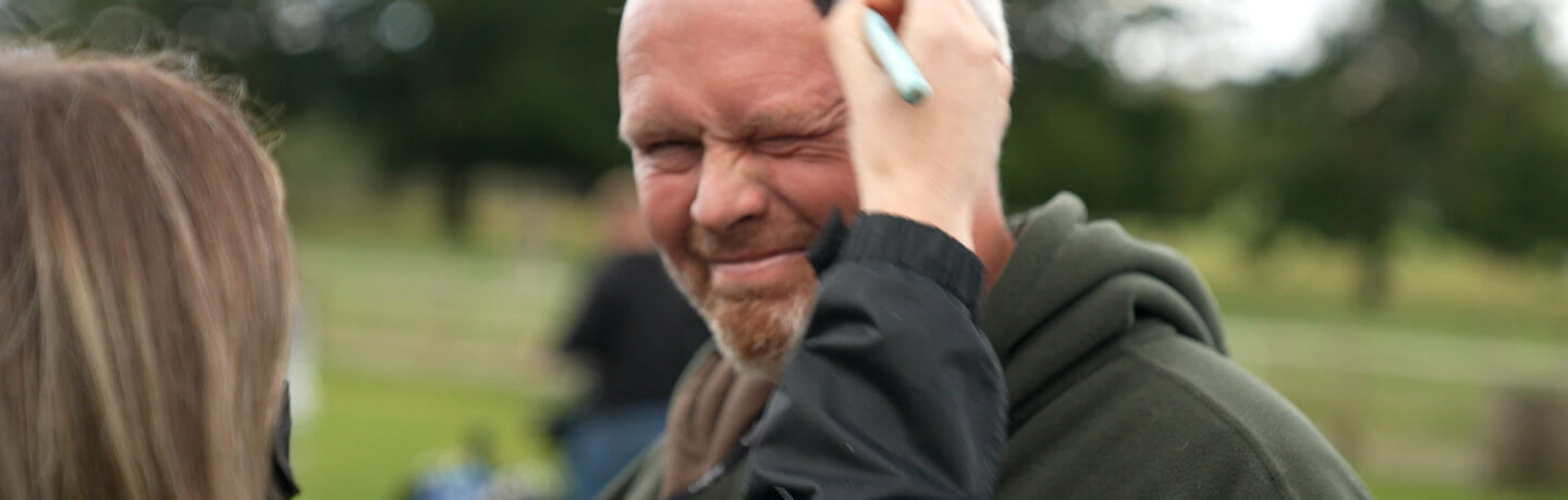 Photo of Rob Nicholson having make up applied before filming